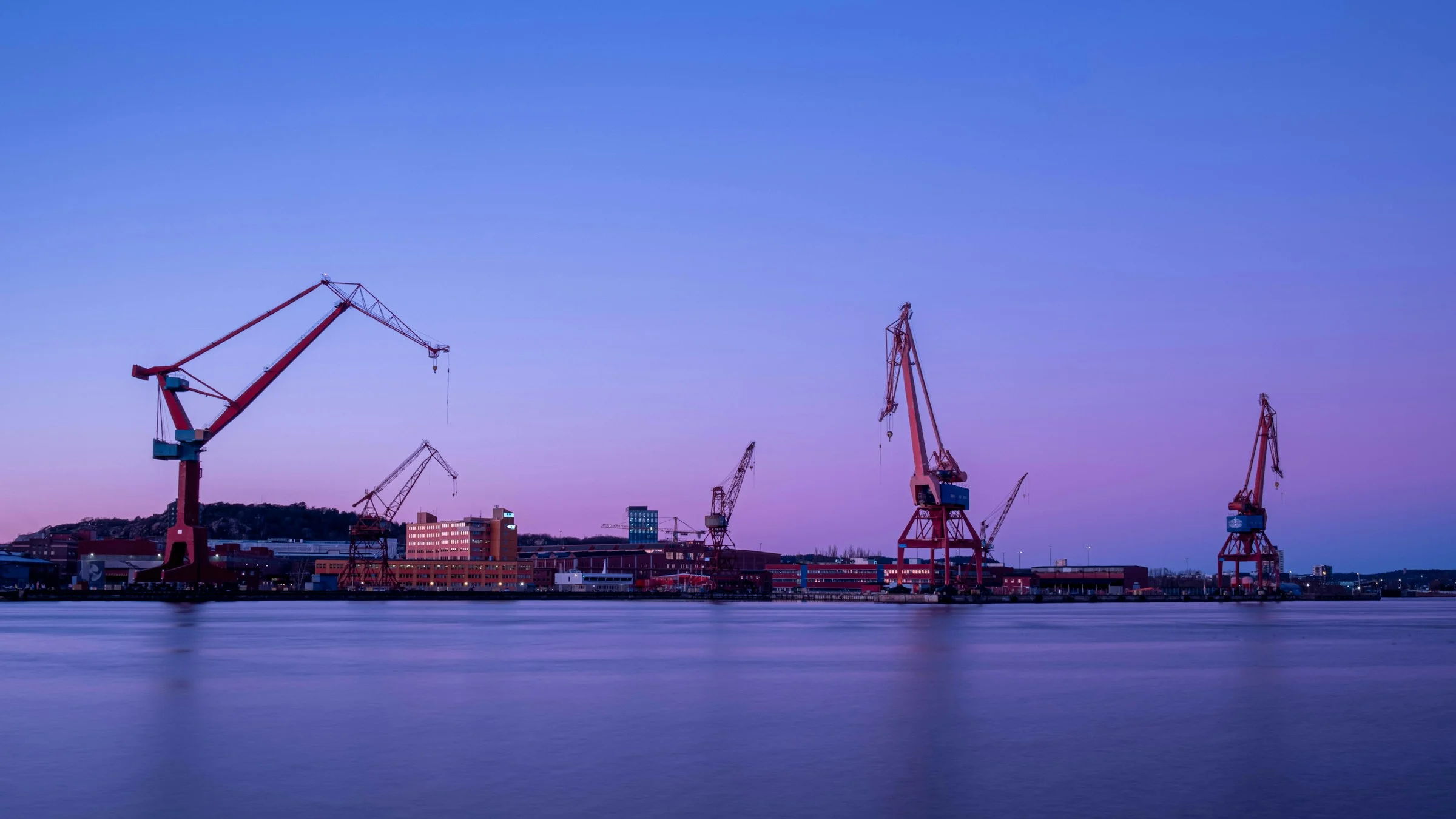 Port cranes at dusk