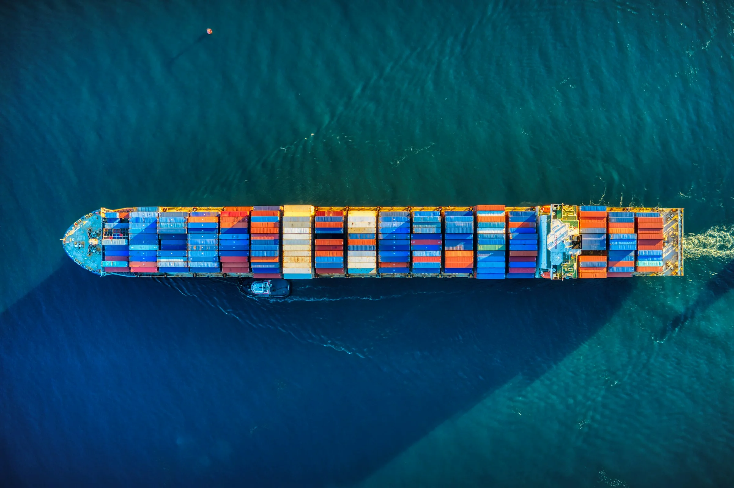 A container ship at sea seen from above